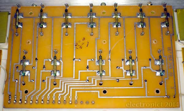 board lifted showing magnetic reed switches
